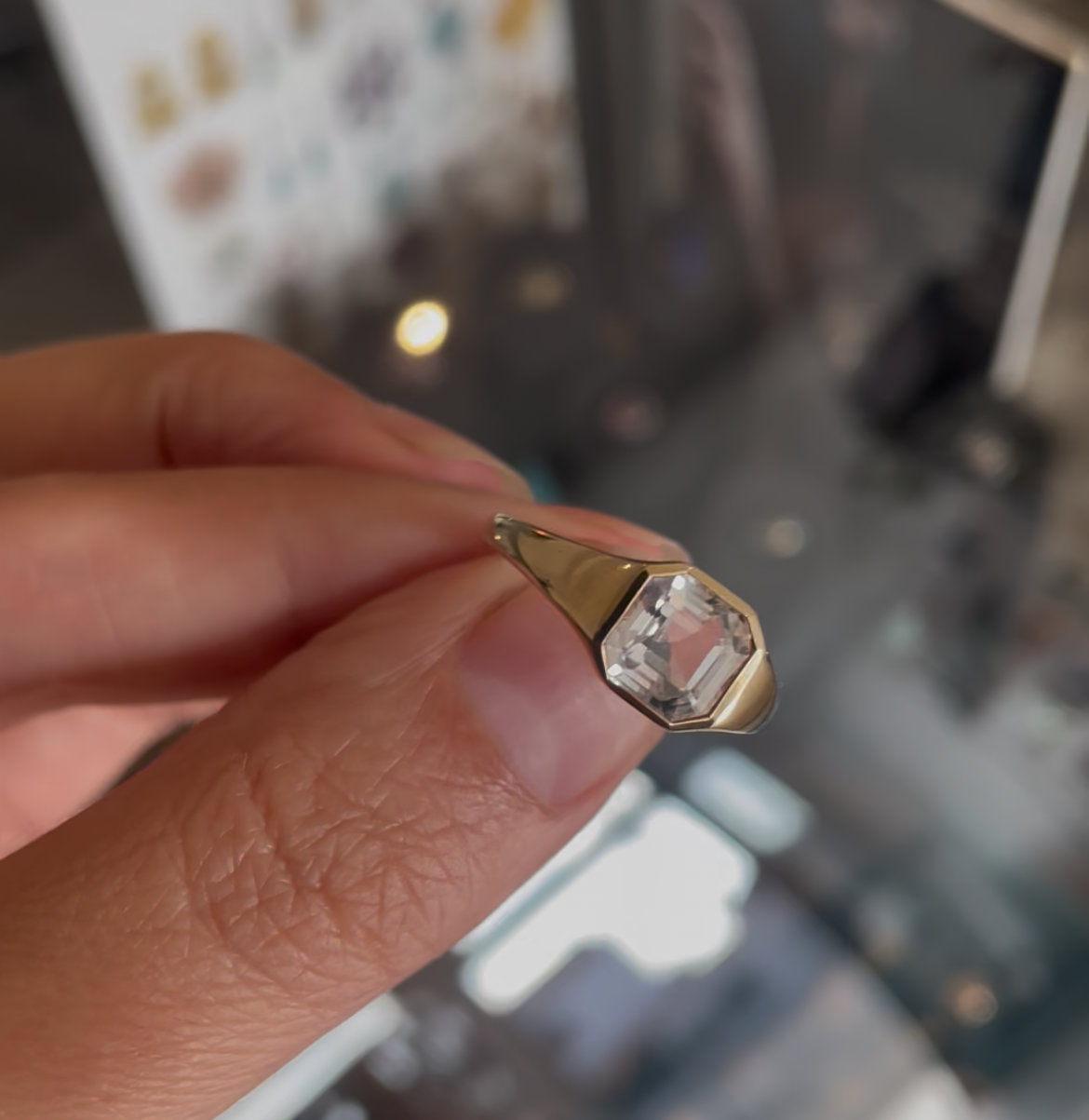 An Asscher cut white topaz ring set in 9kt gold