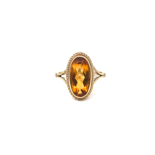 An elegant vintage citrine ring, a deep orange gemstone set in 9kt gold.