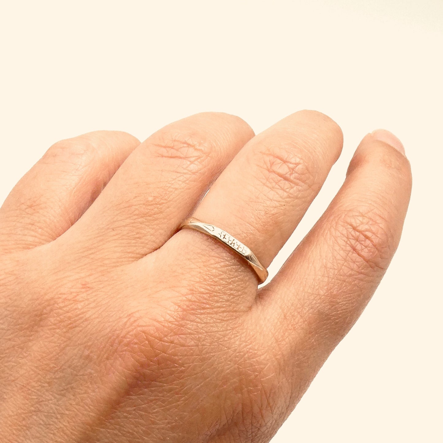 Vintage octagon ring, 9kt gold with etched patterning on four faces.