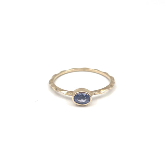 Tanzanite stacking ring on a 9kt wave band, preowned.