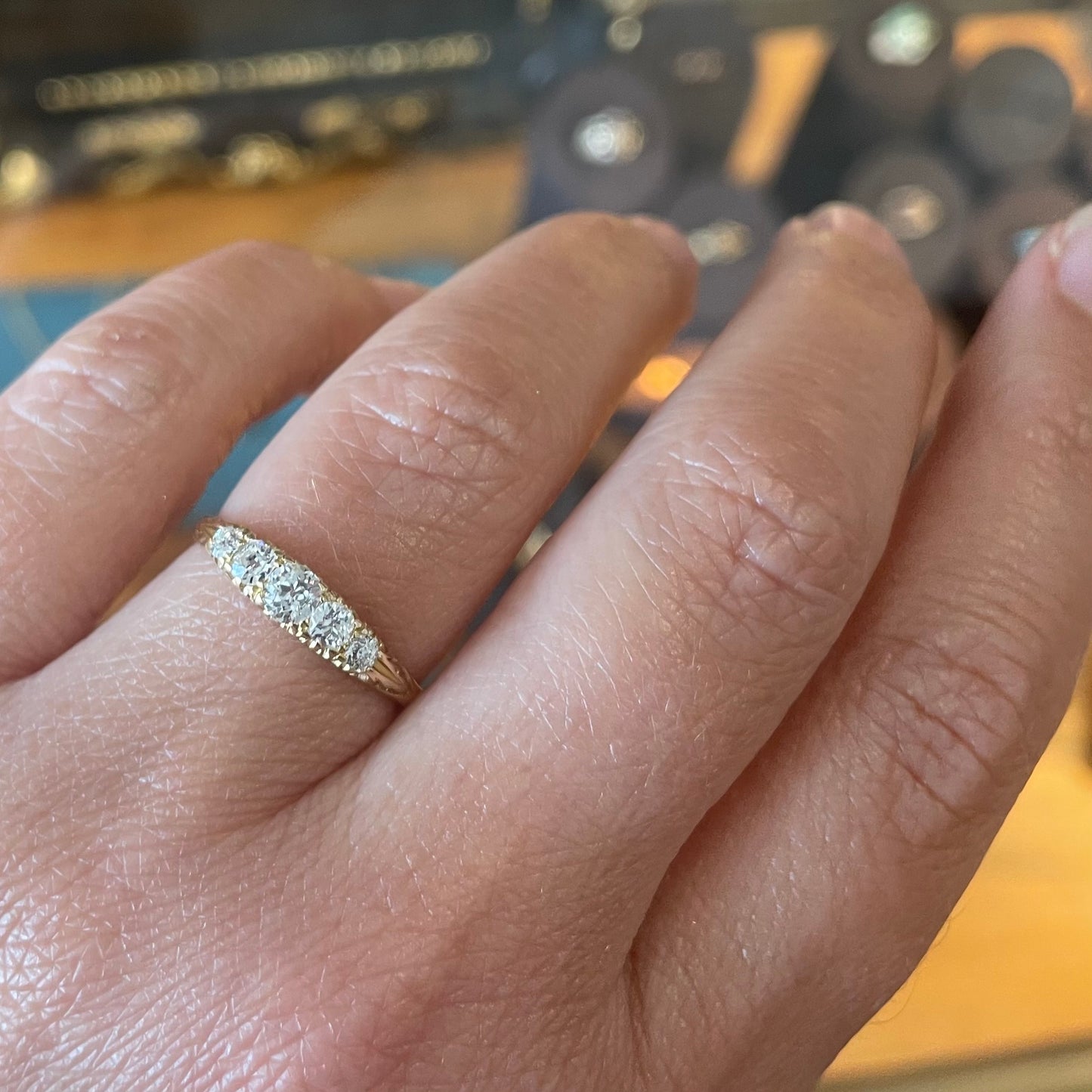 Antique Diamond ring set with five old European cut Diamonds.