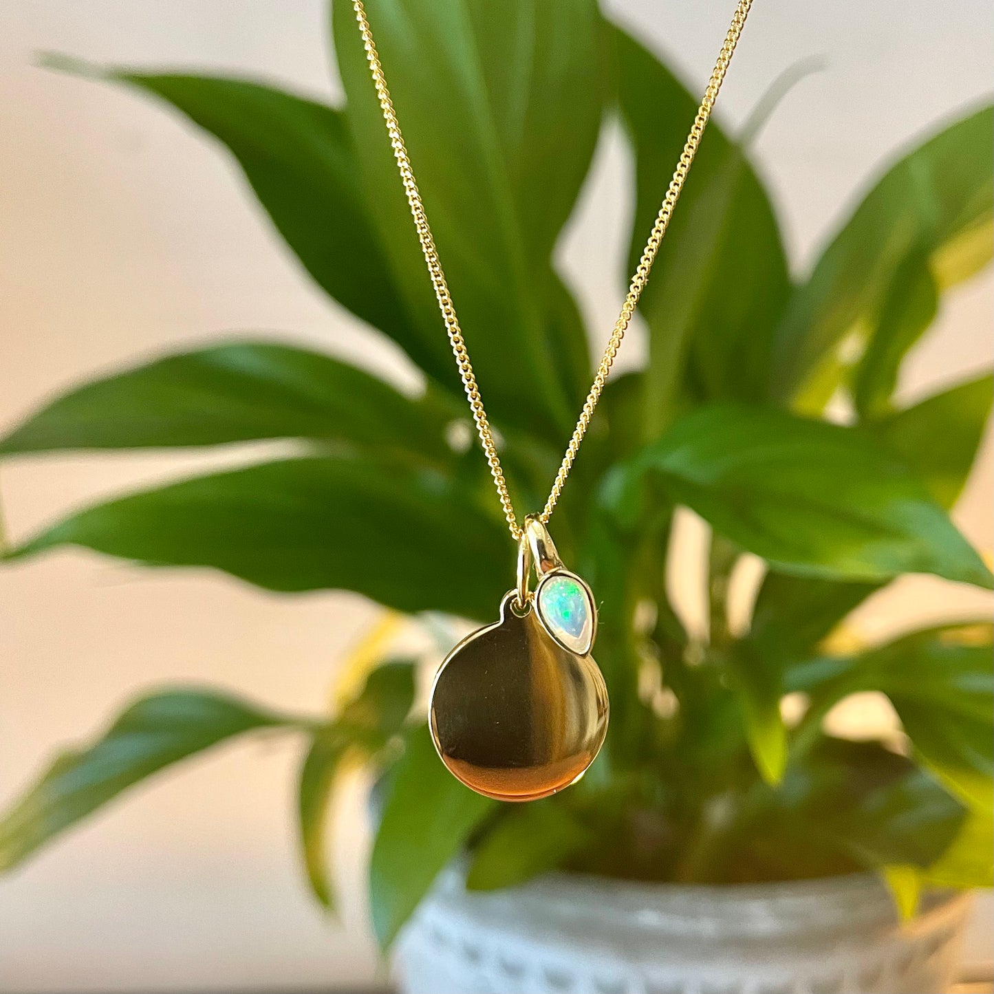 Gold Disc pendant with a Opal  charm for an October Birthday.