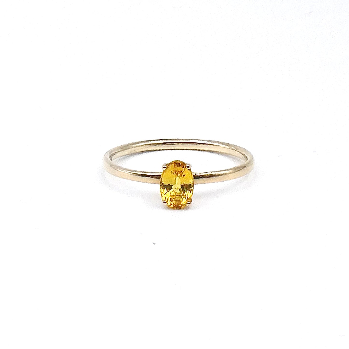 A yellow oval cut Sapphire,  a fine new 9kt gold ring.