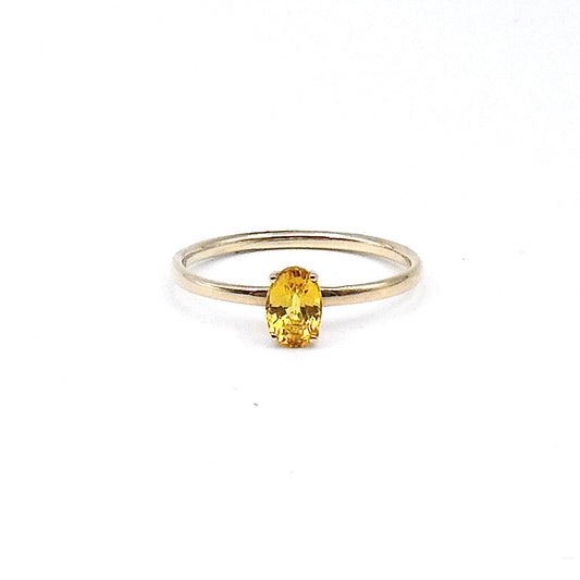 A yellow oval cut Sapphire,  a fine new 9kt gold ring.