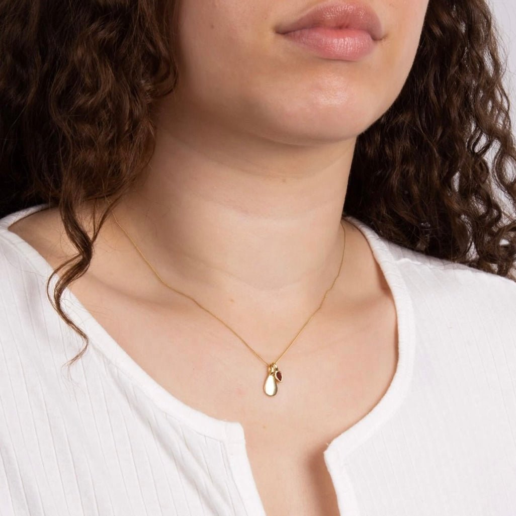 Gold plated pendant with a garnet drop on a fine chain, Garnet for January. - Collected