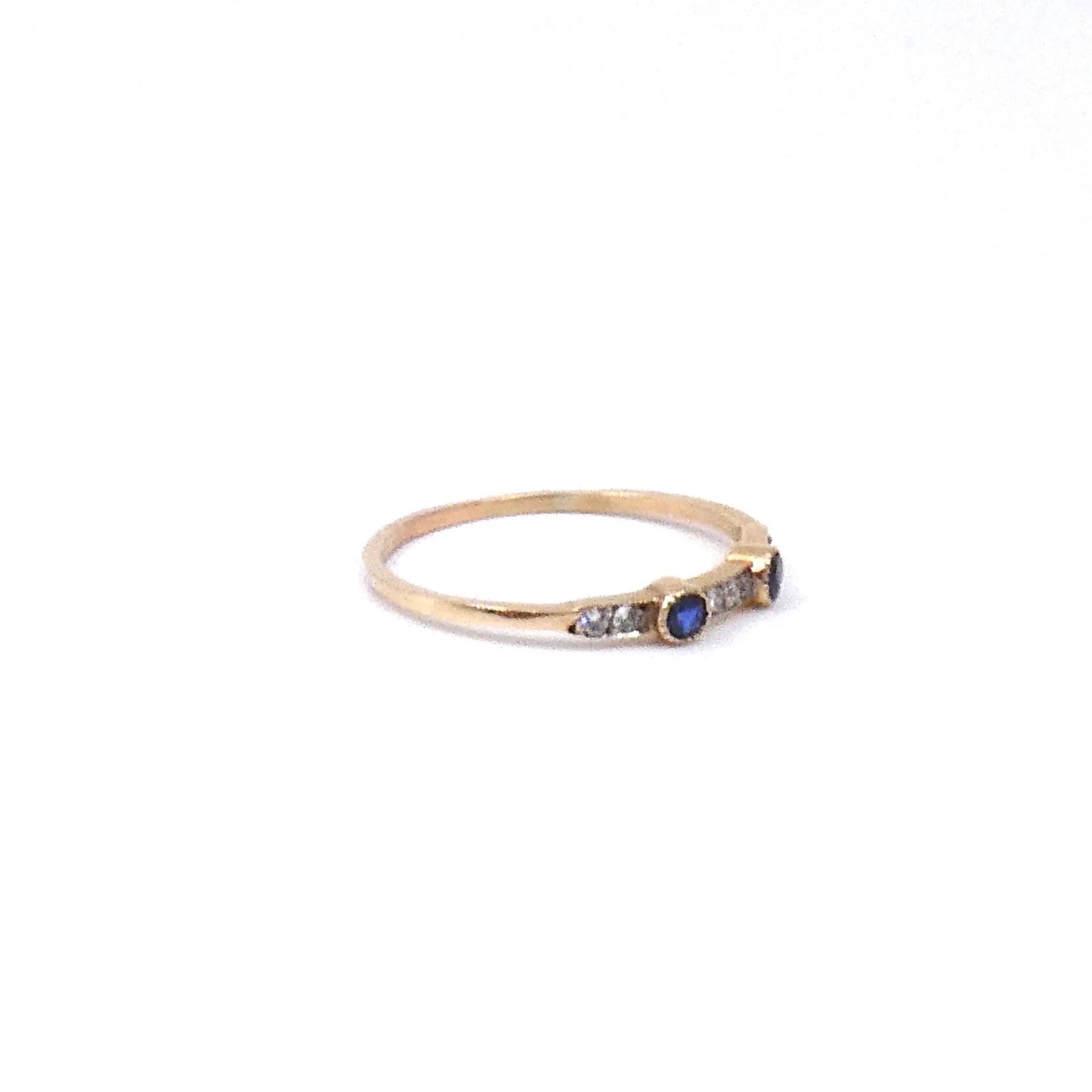 A vintage gold stacking band set with sapphires and diamonds 9kt gold.