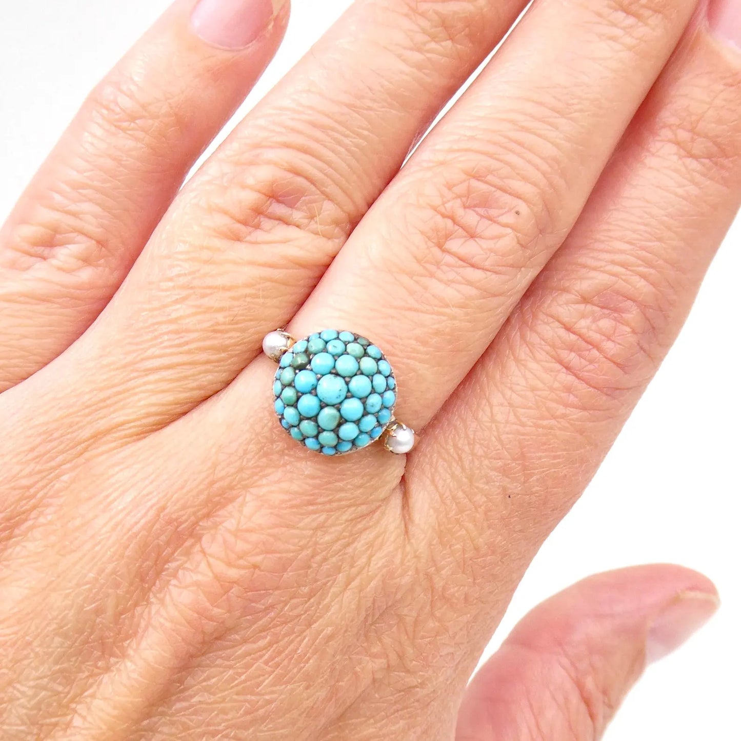 Antique turquoise bombe ring with a small pearl on either side, antique turquoise ring