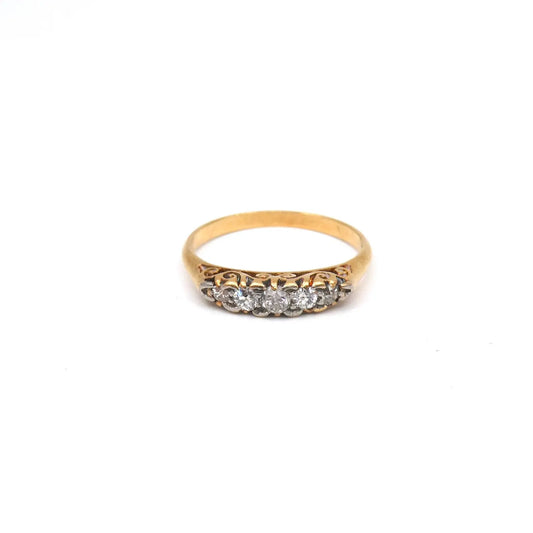 Antique five diamond ring, with ornate scroll work on the sides.