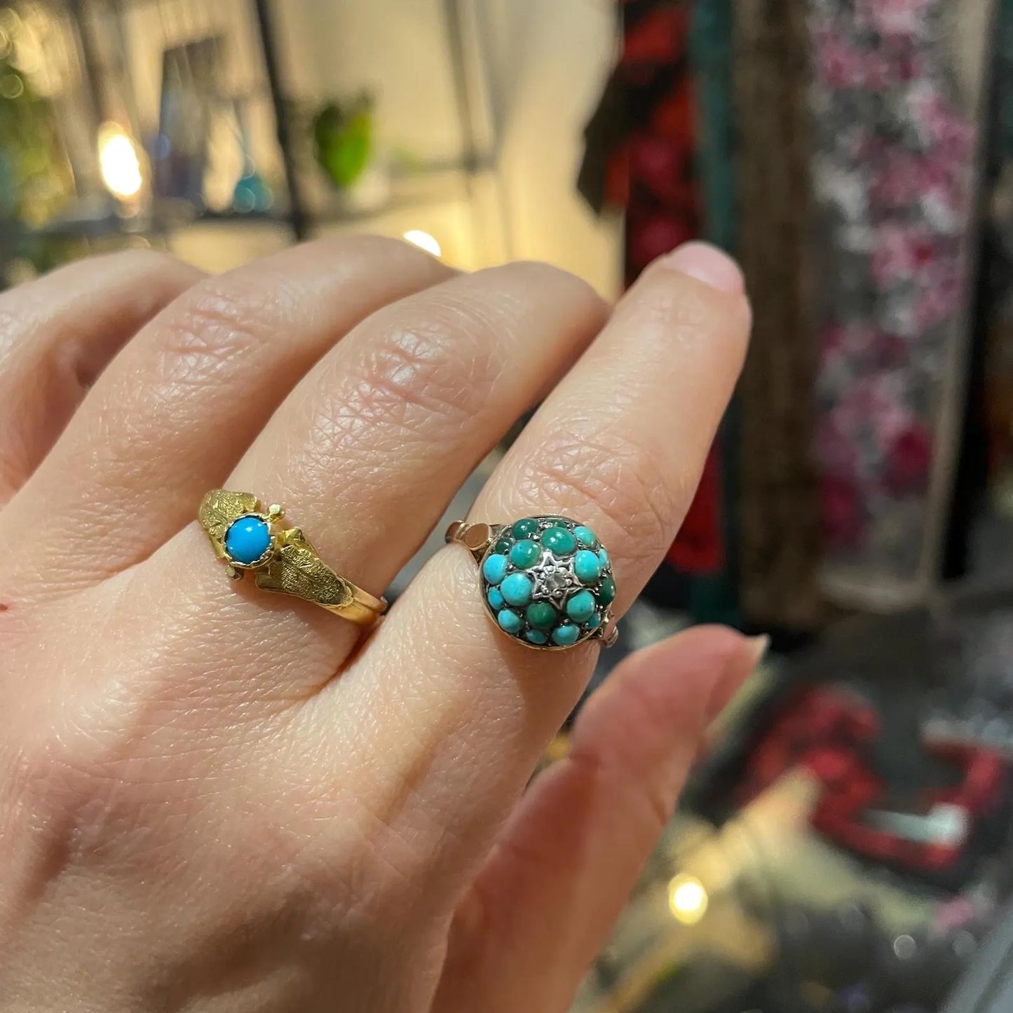 An antique turquoise bombe ring set with a star in the centre with a little diamond.