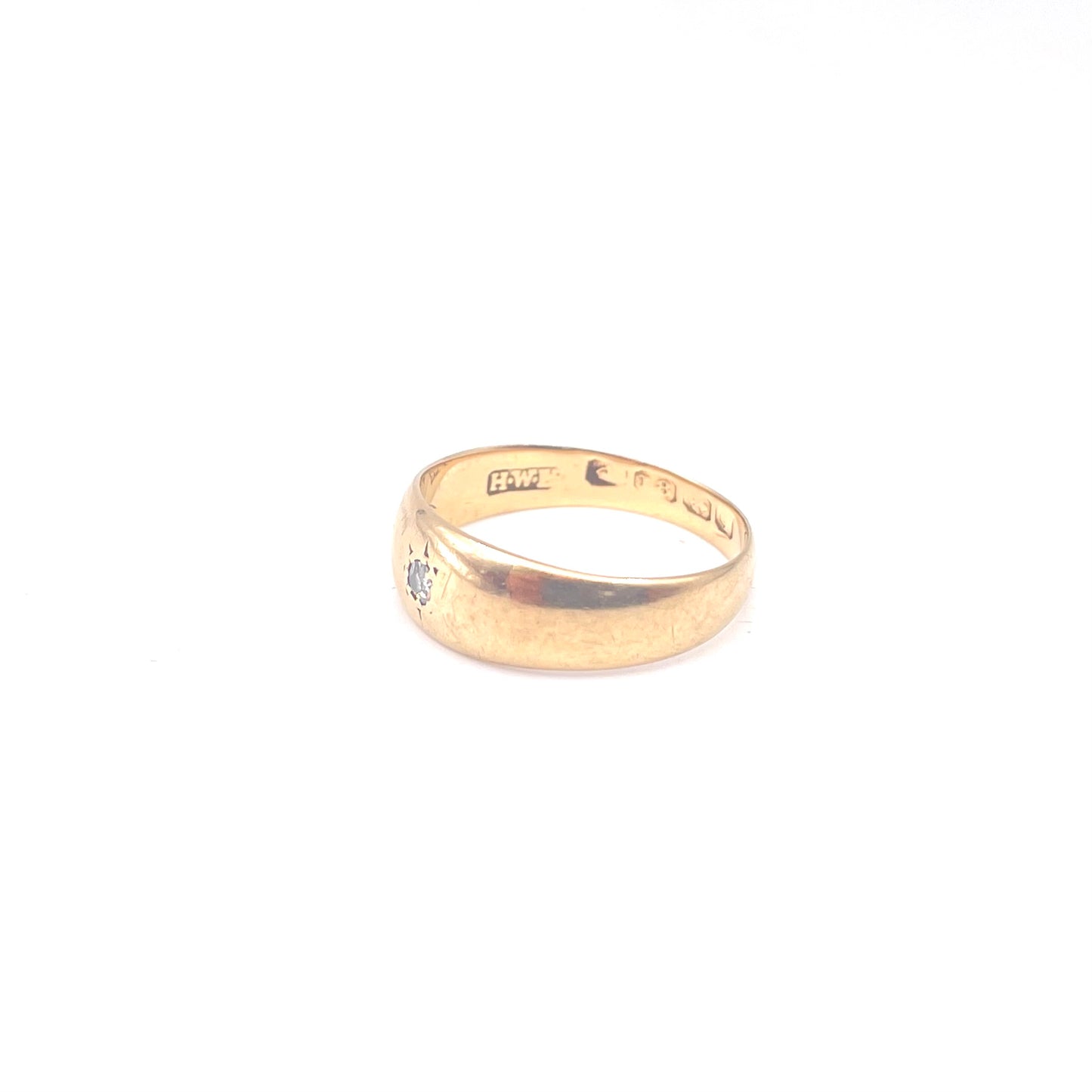 Antique 18kt gold gypsy ring set with a single cut diamond.