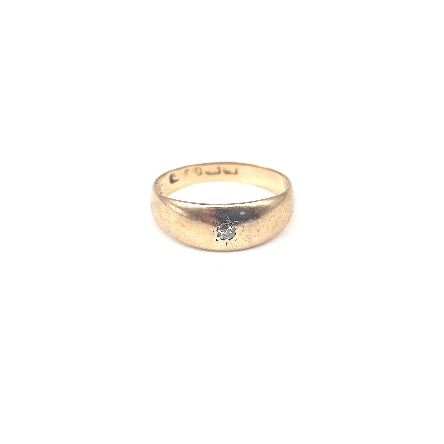 Antique 18kt gold gypsy ring set with a single cut diamond.