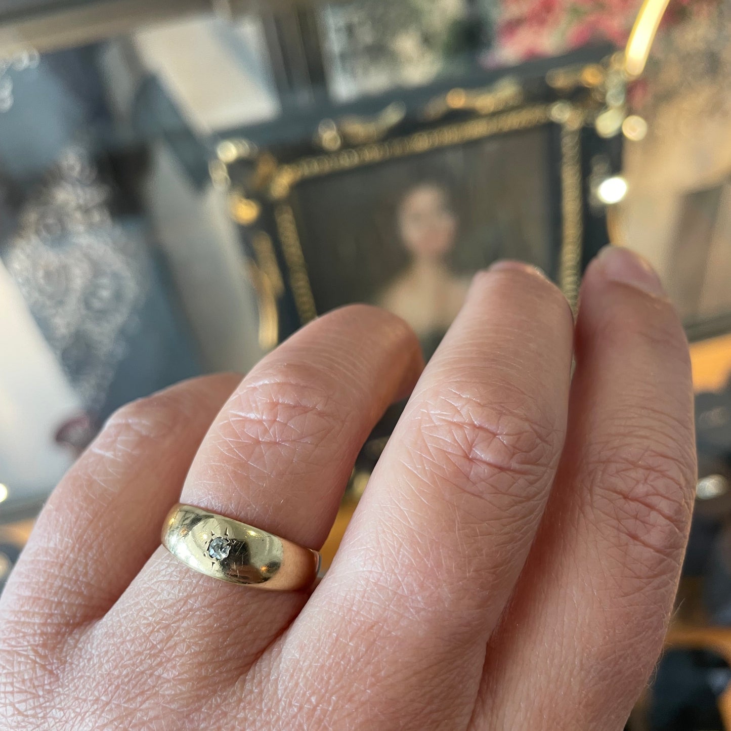 Antique 18kt gold gypsy ring set with a single cut diamond.