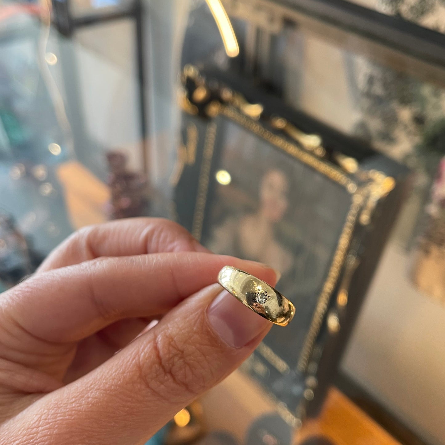 Antique 18kt gold gypsy ring set with a single cut diamond.