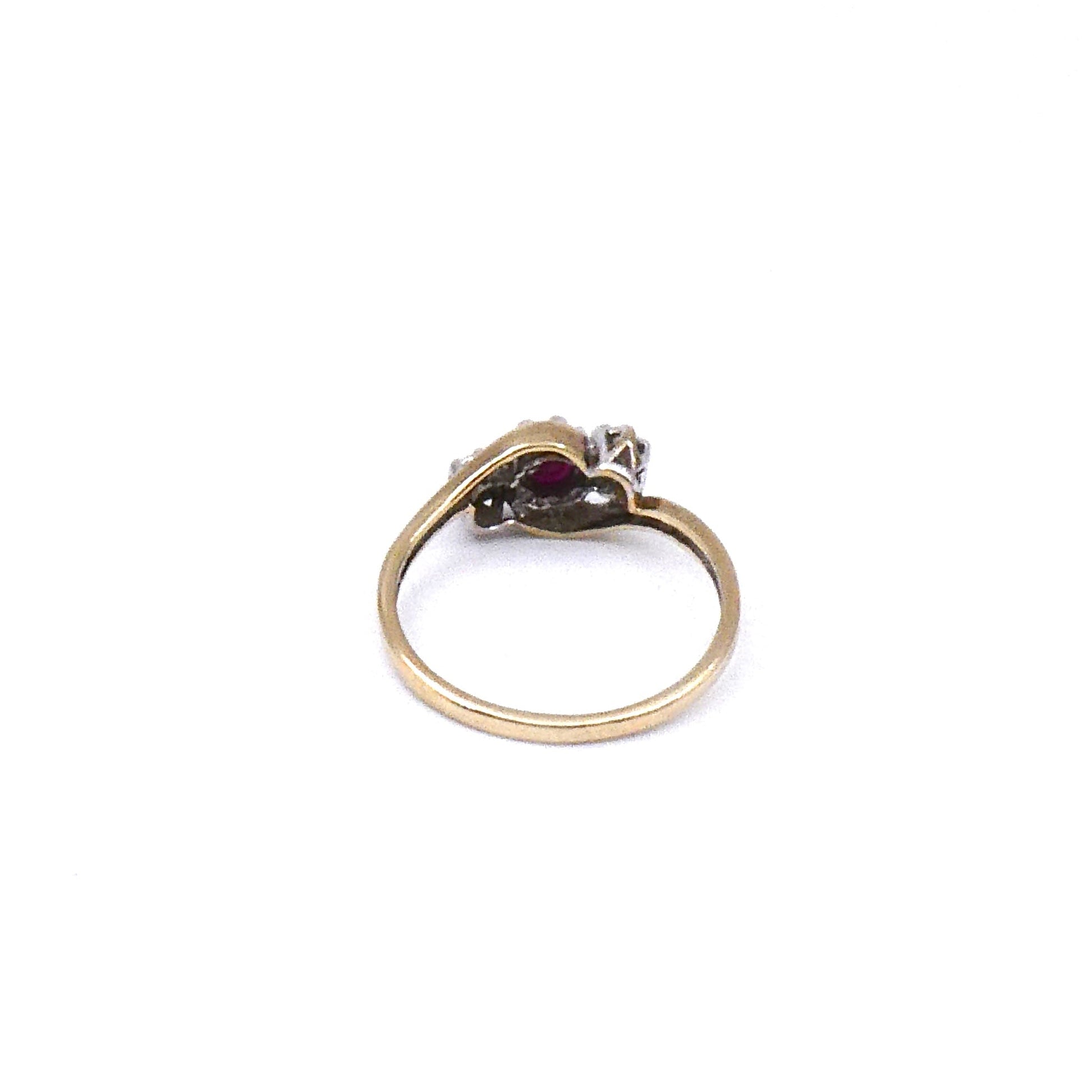 Vintage ruby and diamond ring, a classic three stone ring with a curved 9kt gold band. - Collected