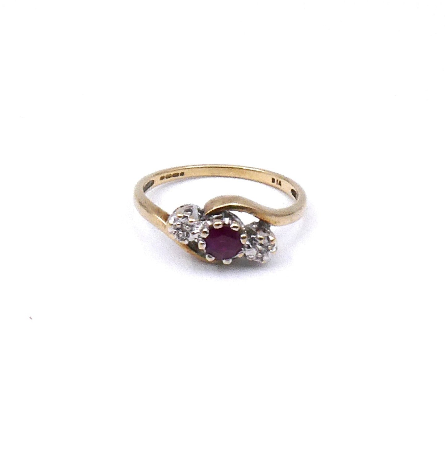 Vintage ruby and diamond ring, a classic three stone ring with a curved 9kt gold band. - Collected