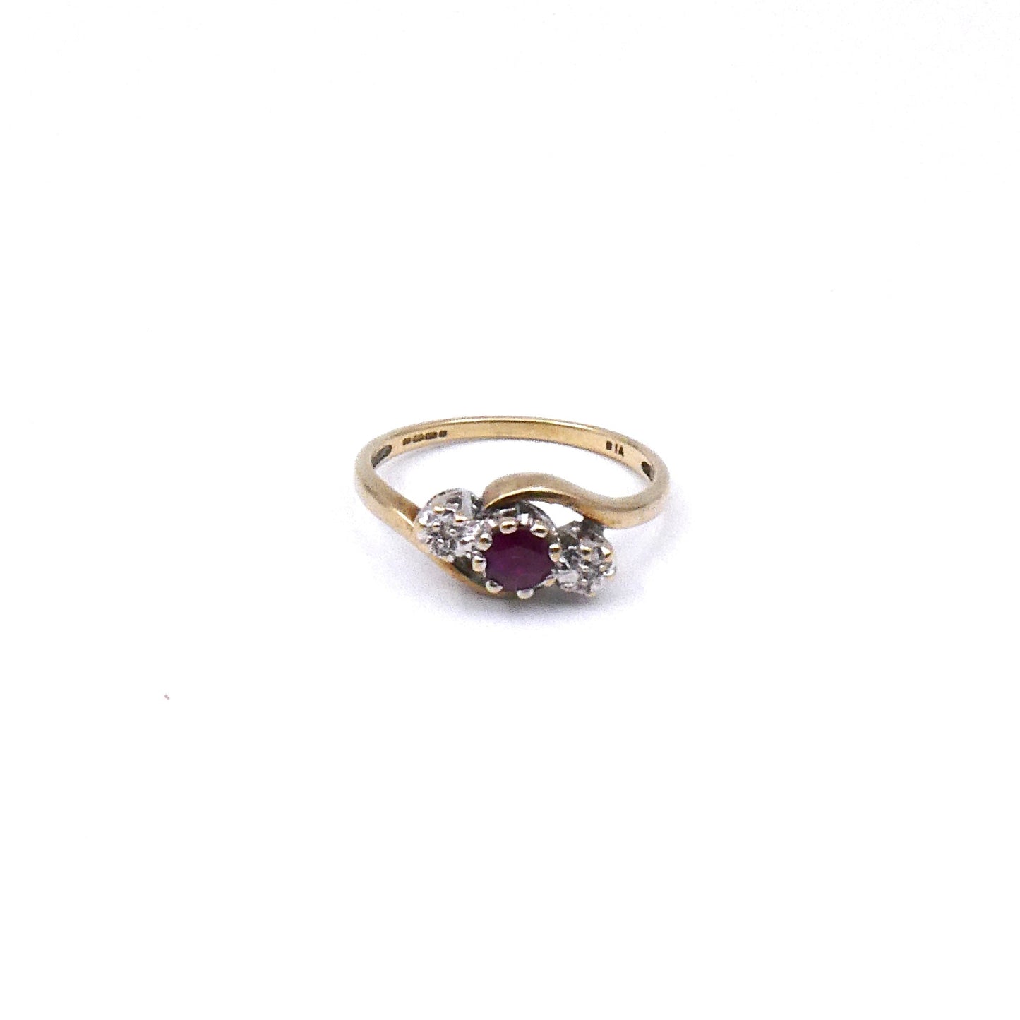 Vintage ruby and diamond ring, a classic three stone ring with a curved 9kt gold band. - Collected