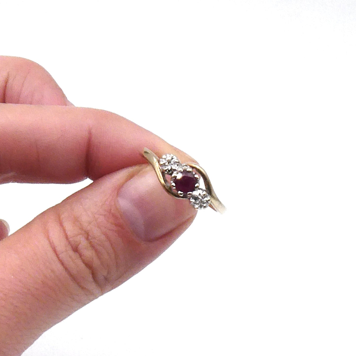 Vintage ruby and diamond ring, a classic three stone ring with a curved 9kt gold band. - Collected