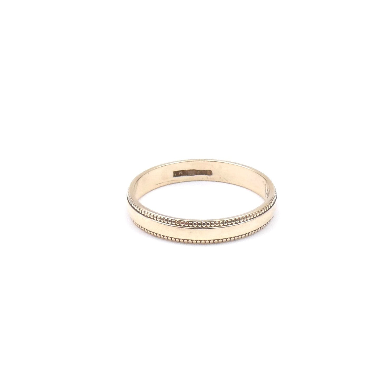 A gold band with a beaded edge, 9kt gold wedding band with detail. - Collected