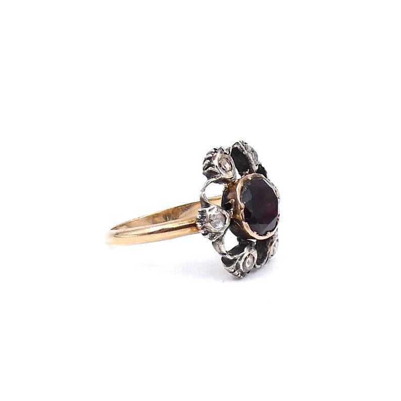 Antique garnet and old cut diamond ring with an open design. - Collected