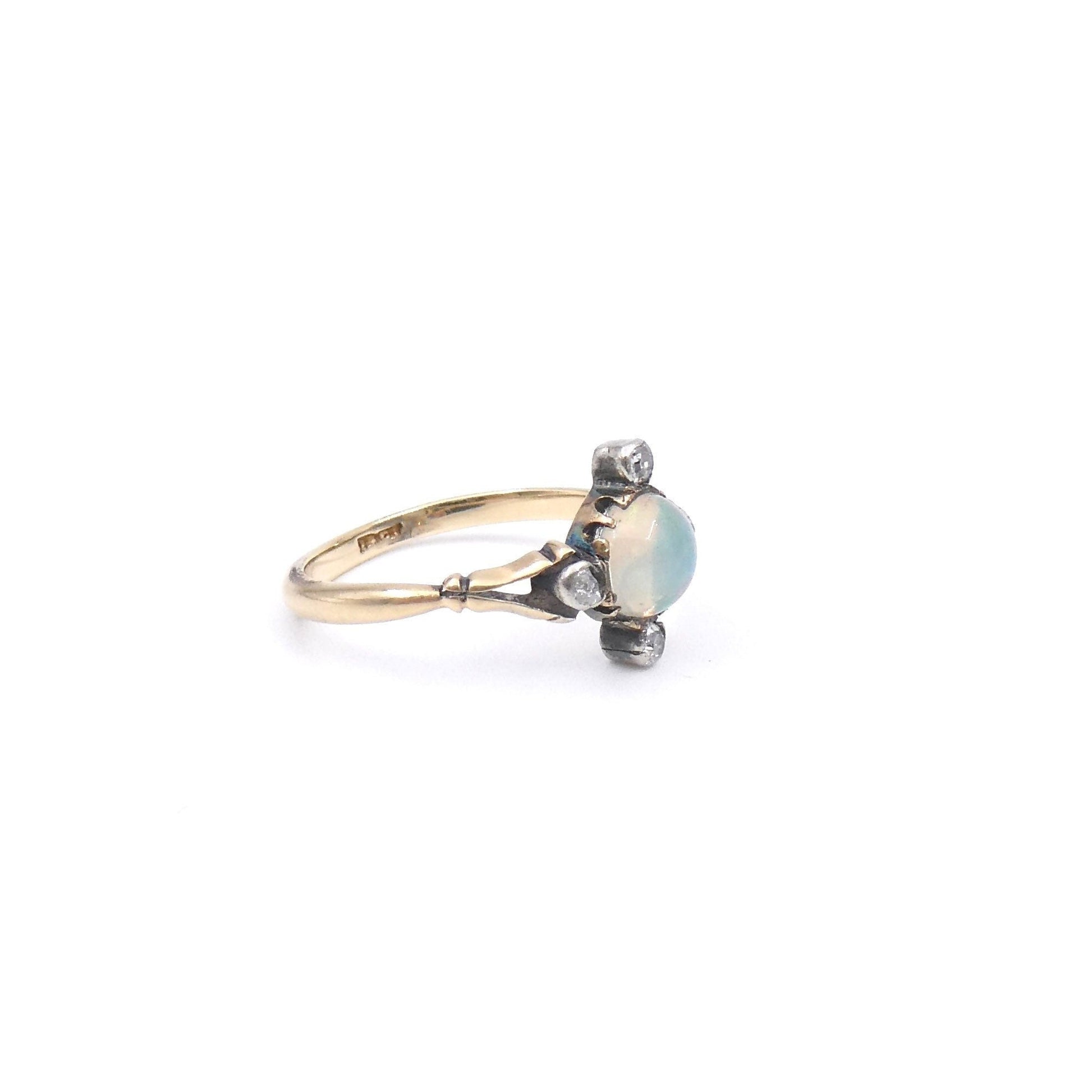 Antique opal and diamond ring, set with an iridescent opal and old cut diamonds. - Collected