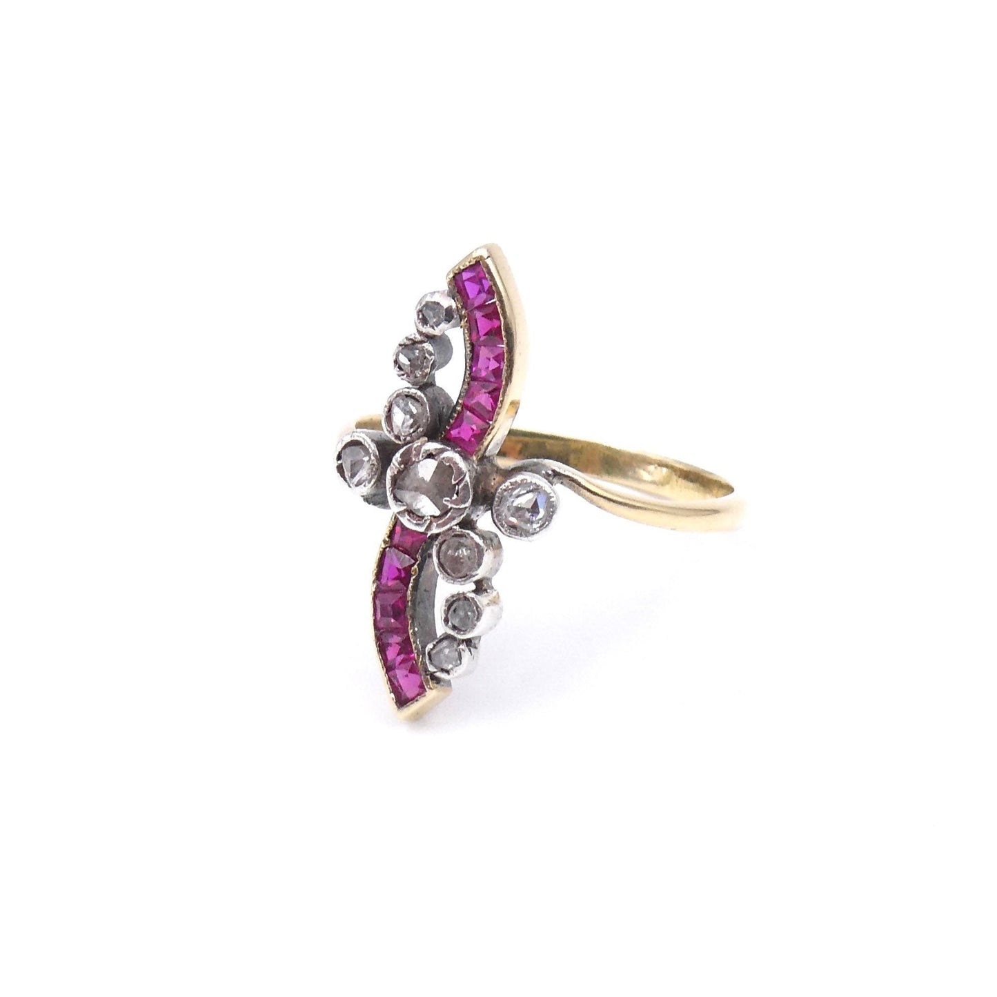 Art Deco style ruby ring, bow shaped set with step cut rubies and rose cut diamonds. - Collected