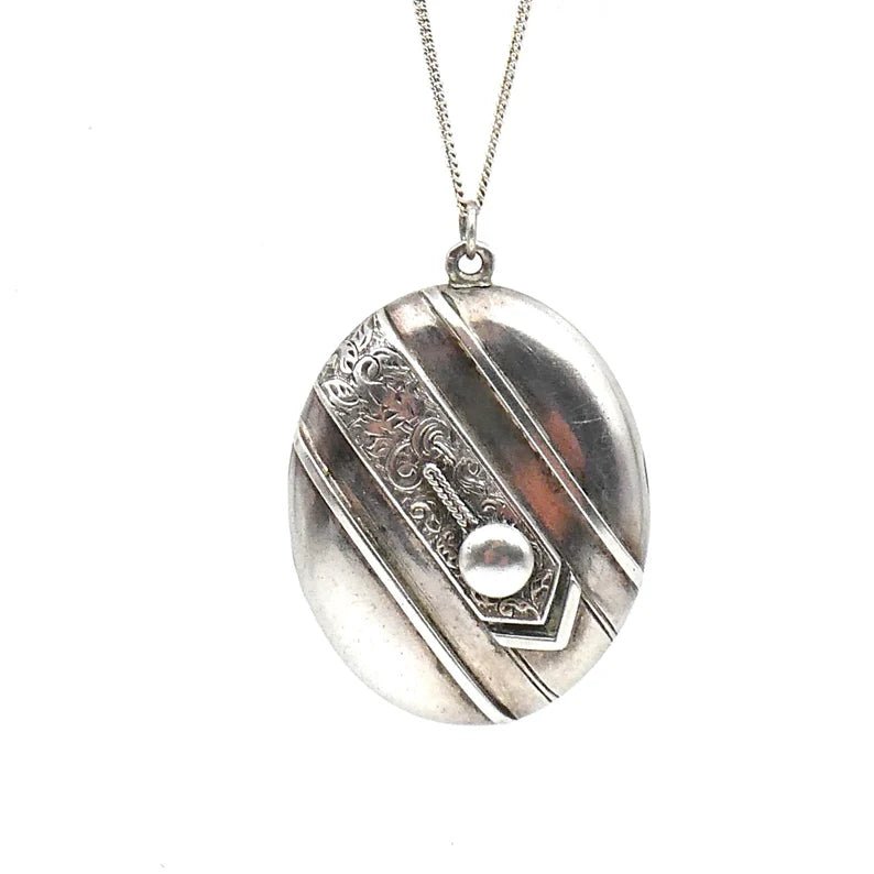 Beautiful vintage locket, large oval silver locket with an ornate engraved band diagonally across the locket - Collected