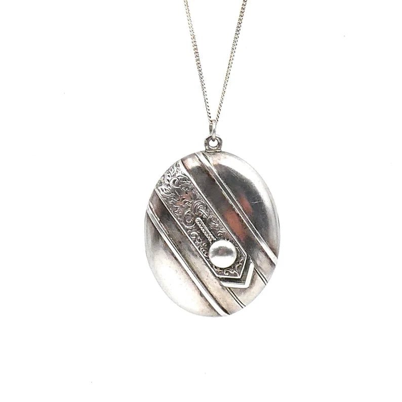 Beautiful vintage locket, large oval silver locket with an ornate engraved band diagonally across the locket - Collected