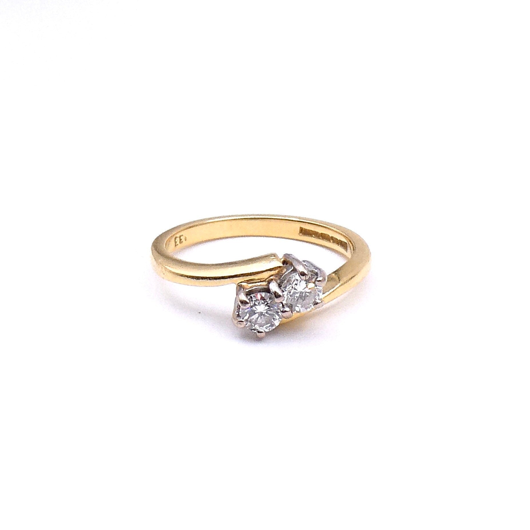 Diamond promise ring, a two stone diamond twist ring in 18kt gold a classic style. - Collected