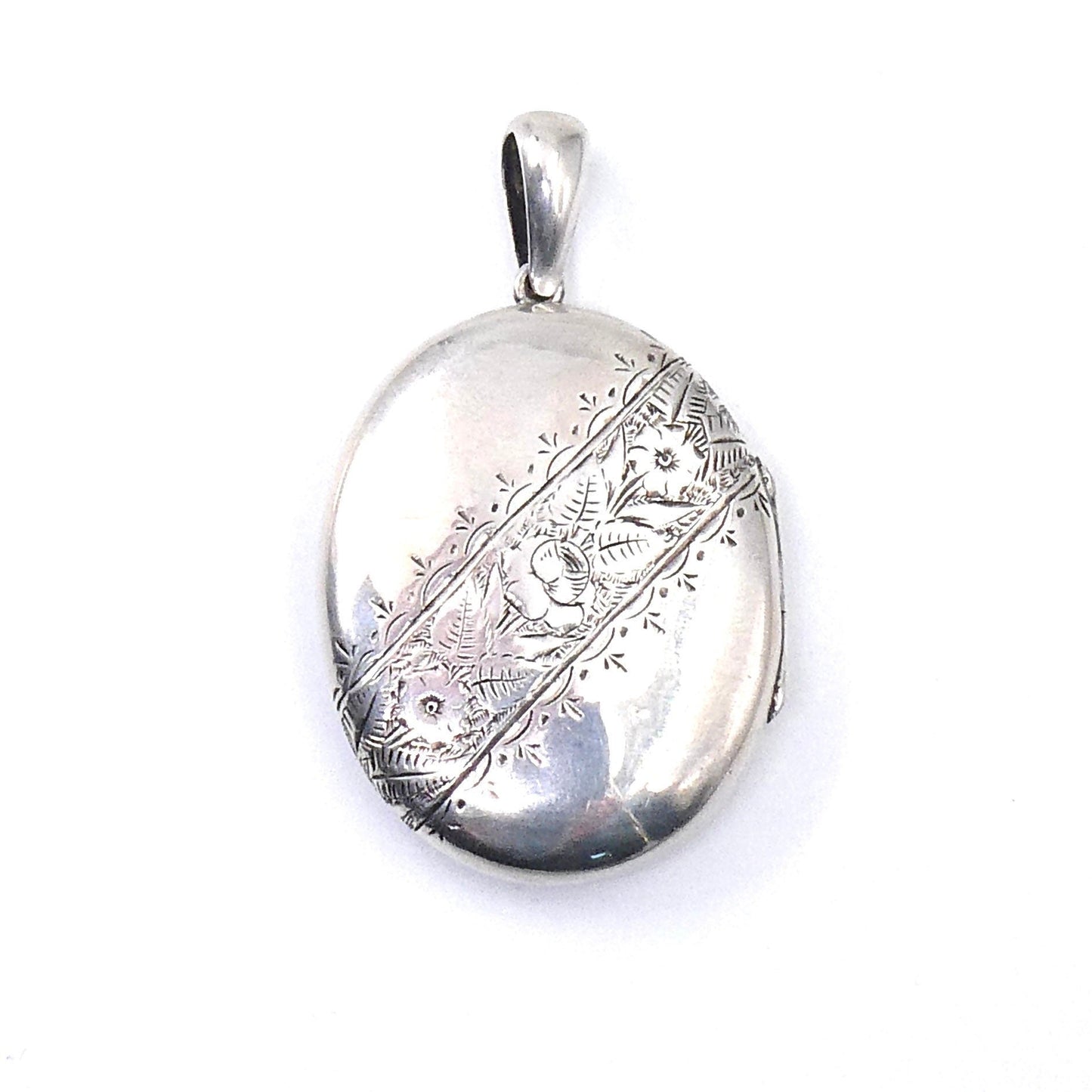 Engraved vintage locket, large oval silver locket with floral and leaf engraving diagonally across the locket. - Collected