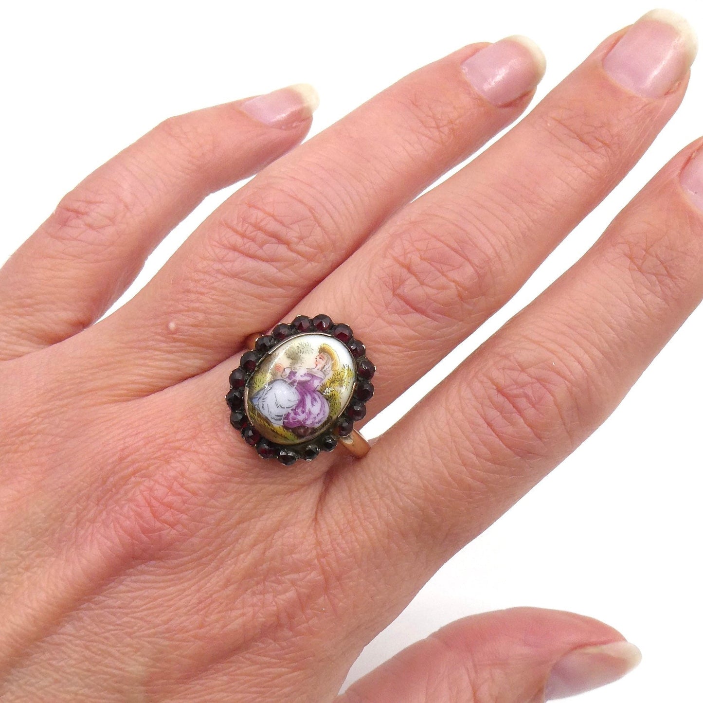 Georgian hand painted gold ring, porcelain ring painted with a lady surrounded by a border of garnets. - Collected