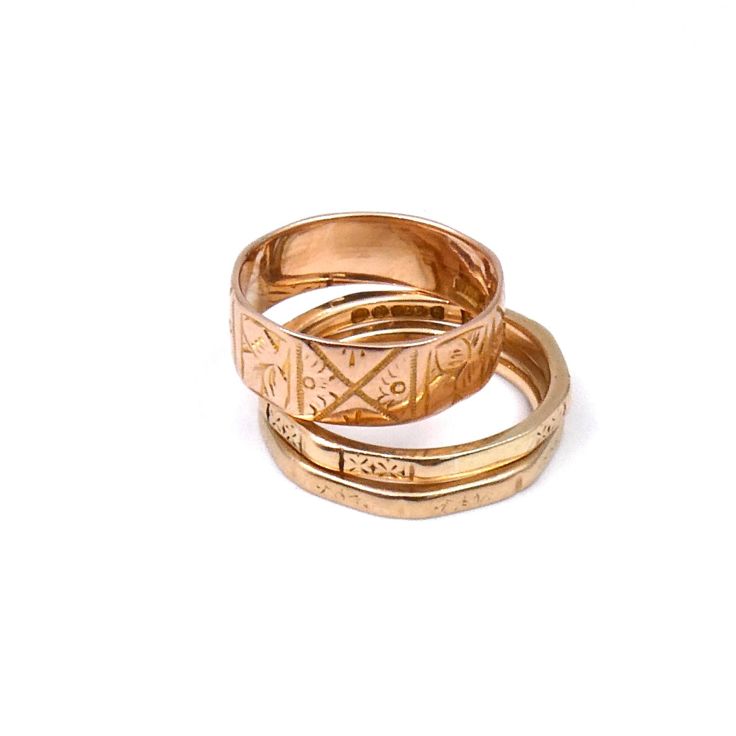 Octagon ring with a faded engraving on each of its faces. - Collected