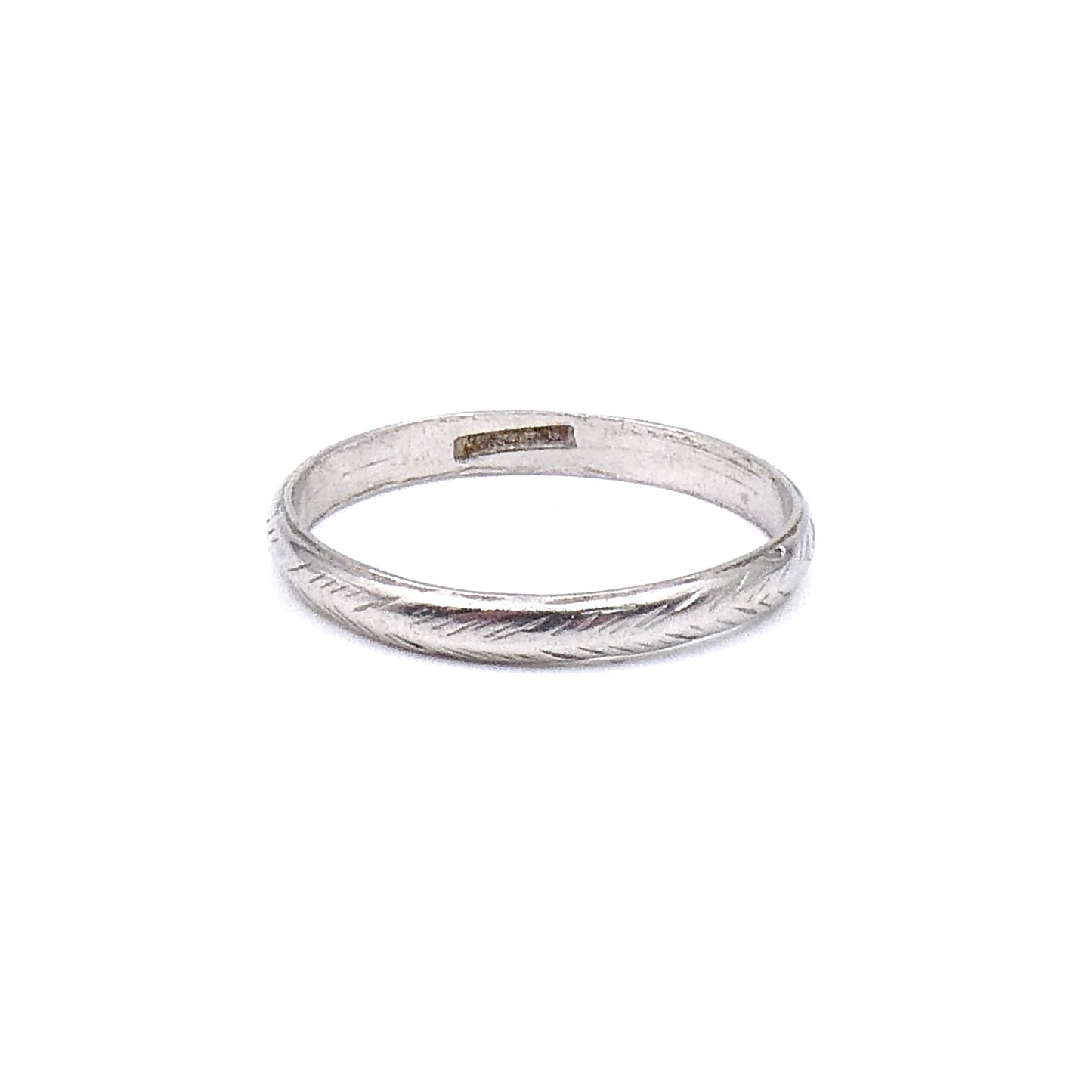 Vintage platinum band with a worn feathered pattern around the band. - Collected